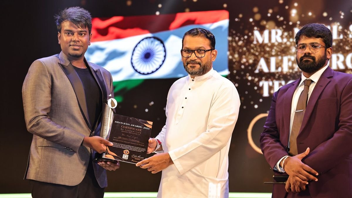 Neel Sagar receiving the Asia's Icon Awards 2024 certificate for Alfa Drones Technology on stage