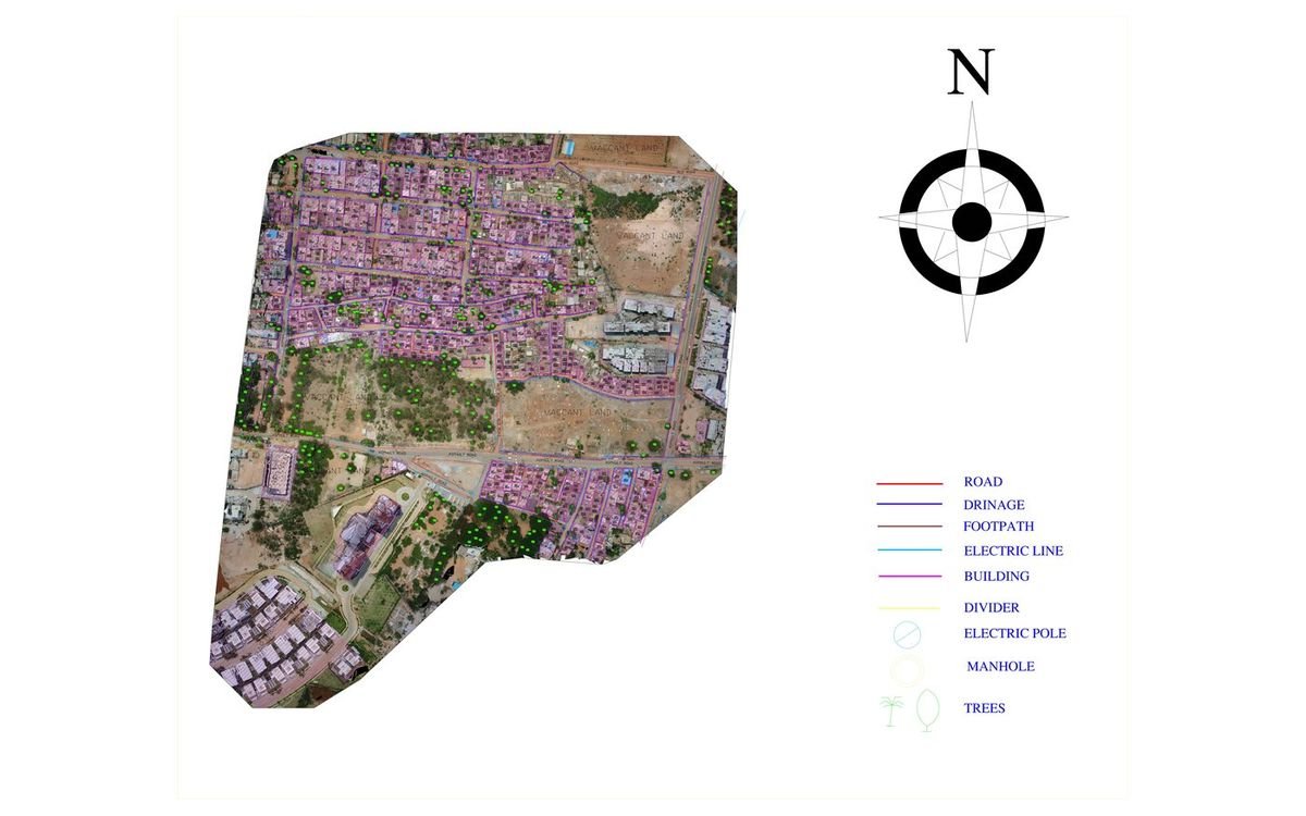 Layered CAD base map of a village over drone orthomosaic, with legend for roads, drainage, buildings and utilities