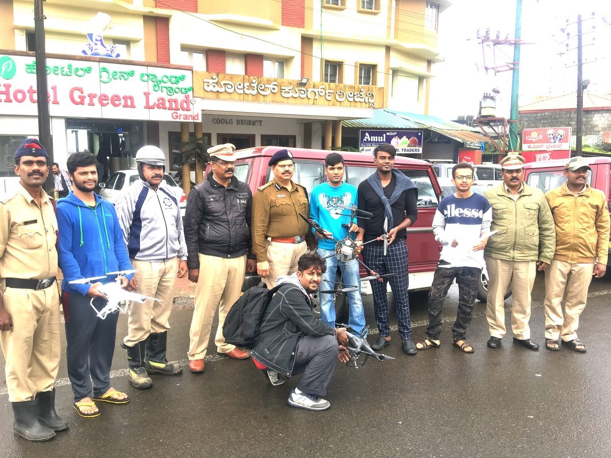 Alfa Drones crew with their aircraft alongside Karnataka police personnel during a civic drone deployment