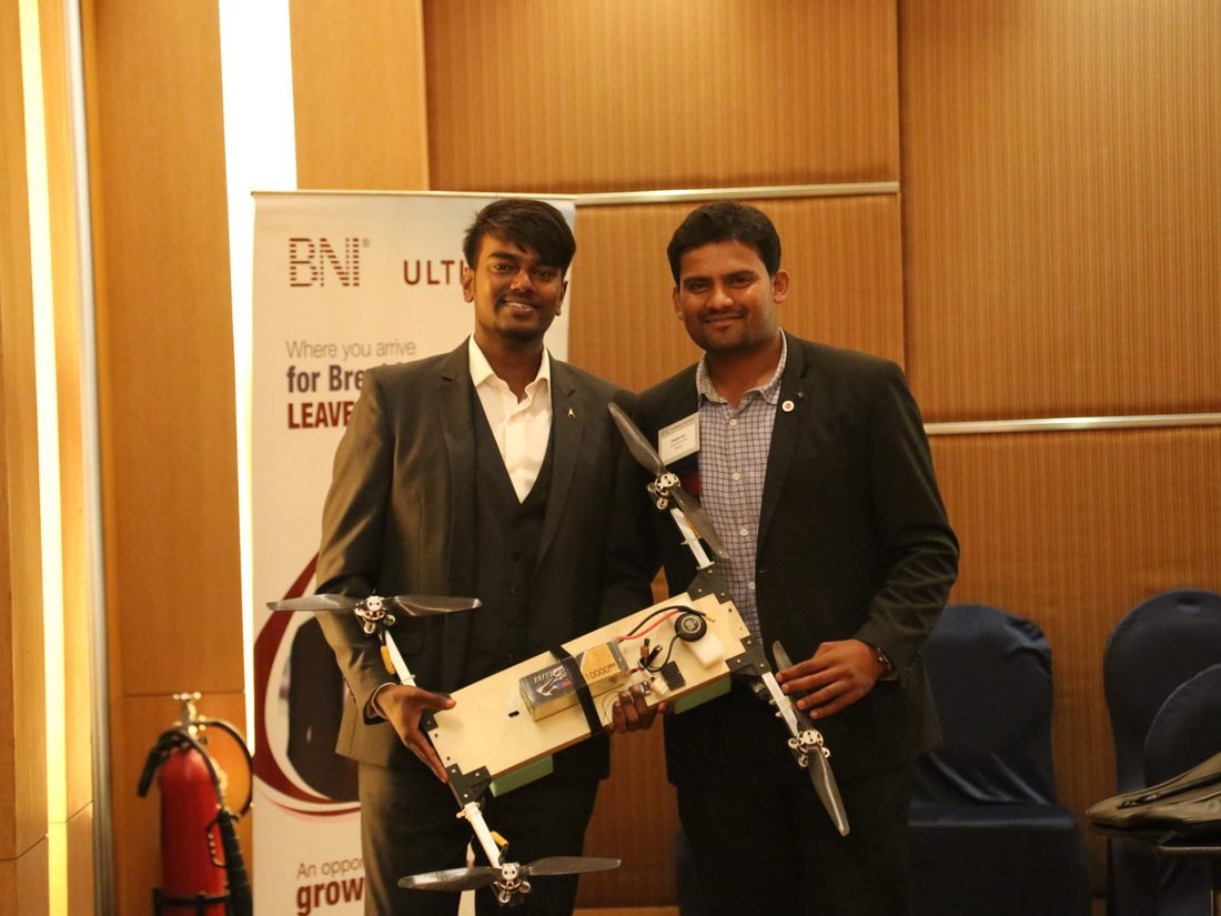 Neel Sagar presenting an in-house built multirotor airframe at a business networking event